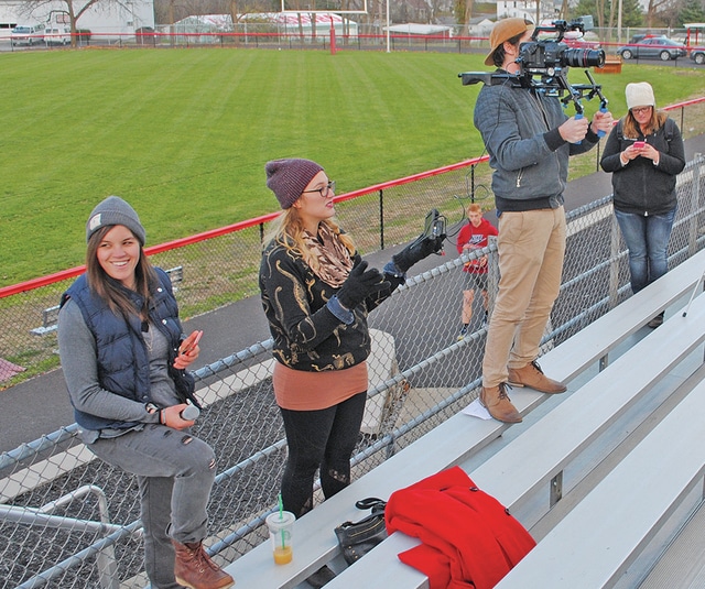 Rachel Hale shoots video at Hillsboro High School football field